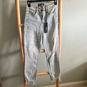 Fashion Nova High Rise Blue Jeans with Distressed Details